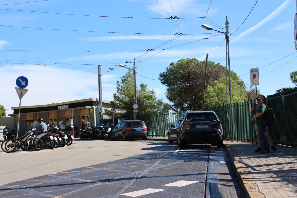 Cars are parking at the tram terminus. The line is out of service for several years and the municipality has still not found money for renovation. The catenary is obviously intended for a pole collector, not a pantograph.