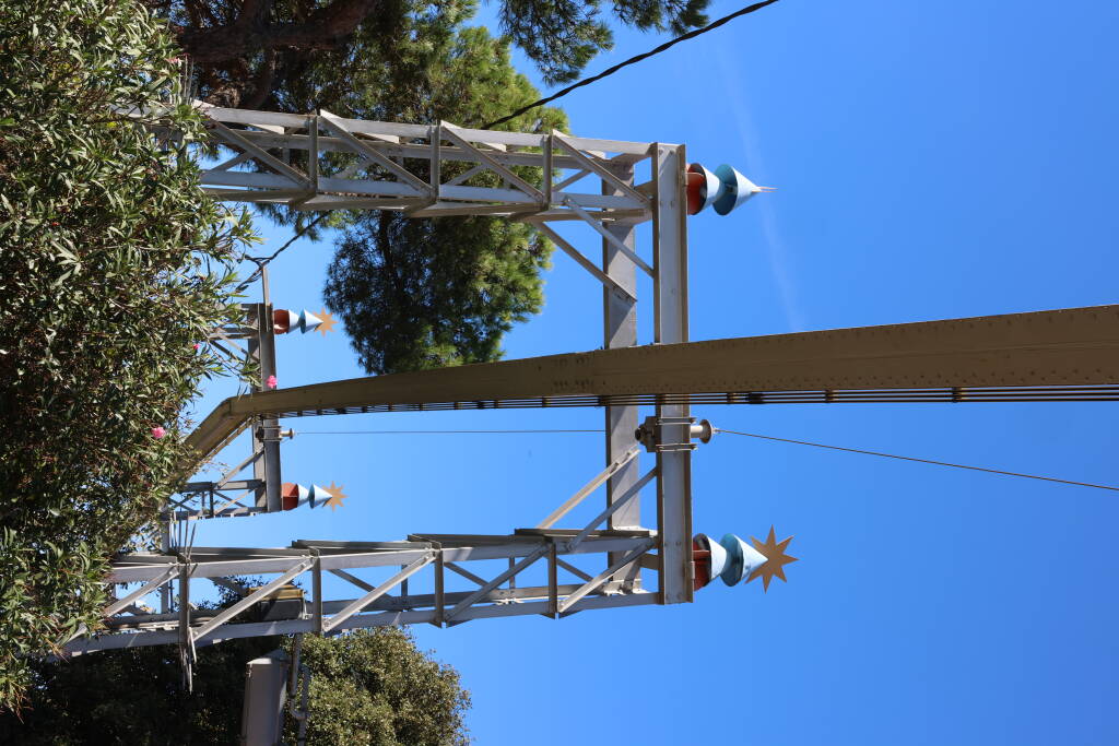 Ornamental construction of an amusement suspended monorail.