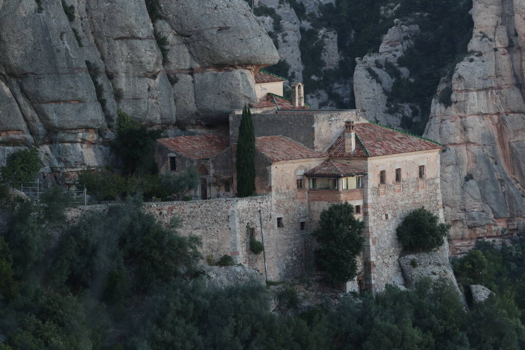 A sacred place built directly on the rock face.