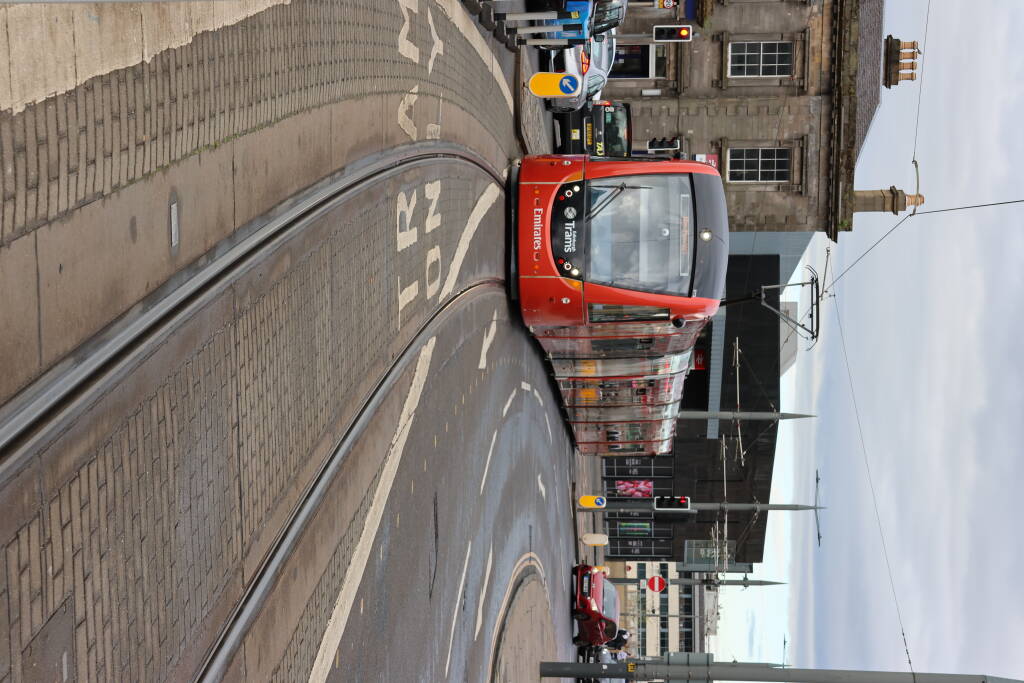 Tram shares the same space with cars at some busy places. Overall, Edinburgh is way more hostila to pedestrians and public transportation, than e.g. Prague.
