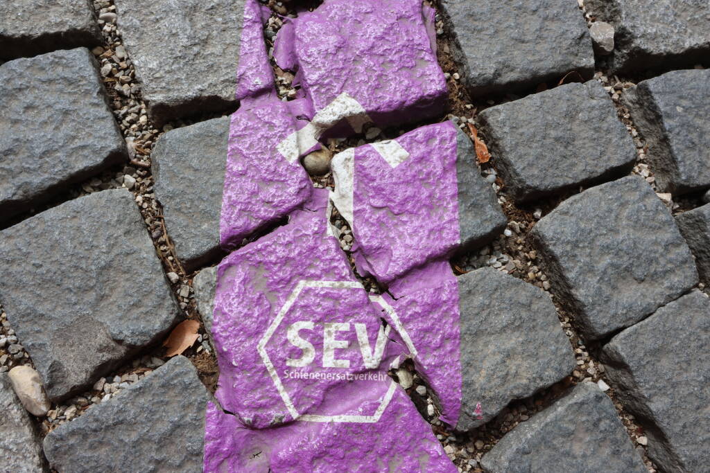 Navigation is painted directly on the sidewalk. For four months of closure it's useful.