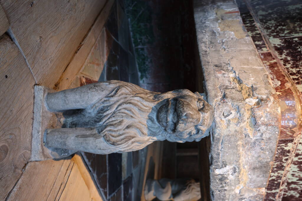 Stove is held up by stone(d) lions.