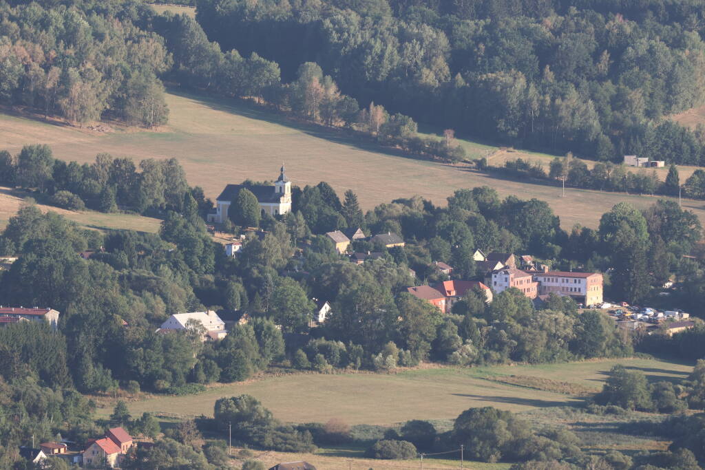 Nemanice village with the church of John from Nepomuk, the Saint. I failed to find what is the original use of the larger building on the right side, №. 90.