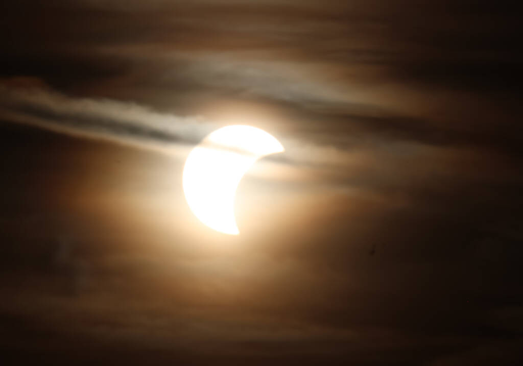 Some clouds cover the sun, some not.